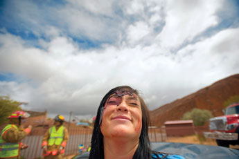 Meagan Madrid tilts her head back and squints her eyes after she has been doused with a healthy helping of fake blood. Madrid acted as a car accident victim as Gallup Fire Department firefighters Thoreau Ambulance rescue personnel demonstrated a realistic rescue scenario for students as part of railroad safety conference at Red Rock Park on Wednesday. © 2011 Gallup Independent / Adron Gardner 